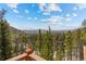 Mountain views from a wooden deck at 72 Overlook Ct, Idaho Springs, CO 80452