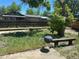 Backyard featuring grill, wooden benches, garden, and wooden fence for privacy at 12879 E Oregon Dr, Aurora, CO 80012