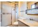 Bathroom featuring shower with glass doors, standard toilet, and vanity with marble top at 12879 E Oregon Dr, Aurora, CO 80012
