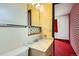 Bathroom featuring vanity sink, mirror, and a towel rack at 12879 E Oregon Dr, Aurora, CO 80012