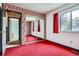 Bedroom with carpeted flooring, closet, and large window at 12879 E Oregon Dr, Aurora, CO 80012