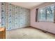 Bedroom with number themed wallpaper and carpeted floor at 12879 E Oregon Dr, Aurora, CO 80012