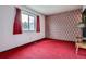 Cozy bedroom features carpeted flooring, and large window at 12879 E Oregon Dr, Aurora, CO 80012