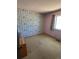 Bedroom with number themed wallpaper and carpeted floor at 12879 E Oregon Dr, Aurora, CO 80012