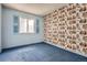 Bright bedroom with a window and vintage wallpaper at 12879 E Oregon Dr, Aurora, CO 80012