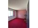 Bedroom with red wallpaper, carpeting, and natural light, perfect for restful nights at 12879 E Oregon Dr, Aurora, CO 80012