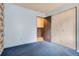Comfortable bedroom featuring carpet, neutral wall colors, and closet space at 12879 E Oregon Dr, Aurora, CO 80012