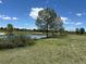 Community park with pond, trees, and gazebo at 12879 E Oregon Dr, Aurora, CO 80012