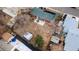 Aerial view of a house and backyard featuring a brick house, a shed, and a patio area at 8140 Pennsylvania Way, Denver, CO 80229