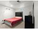 Cozy bedroom with carpet floors, natural light, and a black headboard with silver embellishments at 8140 Pennsylvania Way, Denver, CO 80229