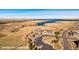 This aerial view showcases the Southshore Lakehouse and the surrounding lake and neighborhood at 27653 E Euclid Dr, Aurora, CO 80016
