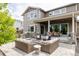 Outdoor living space with a patio, fire pit, grill, and dining area ideal for entertaining guests at 27653 E Euclid Dr, Aurora, CO 80016
