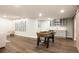 Finished basement with a foosball table, wood floors, a kitchenette, and stylish decor at 27653 E Euclid Dr, Aurora, CO 80016