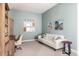 Inviting home office with built-in shelving, comfortable seating, and stylish decor at 27653 E Euclid Dr, Aurora, CO 80016