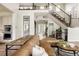 Stylish living room showcasing a staircase, hardwood floors, and an open layout at 27653 E Euclid Dr, Aurora, CO 80016