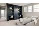 Cozy living room with built-in shelving, comfortable seating, and lots of natural light at 27653 E Euclid Dr, Aurora, CO 80016