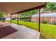 Covered patio overlooking a well-maintained backyard with a storage shed at 1583 Skeel St, Brighton, CO 80601