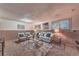 Basement living room featuring neutral colors and large windows for ample light at 1583 Skeel St, Brighton, CO 80601