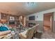 Spacious basement den with a stone fireplace and a TV for entertainment at 1583 Skeel St, Brighton, CO 80601
