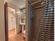 Functional bathroom with a pedestal sink and a shower stall featuring a curtain at 1583 Skeel St, Brighton, CO 80601
