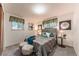 Comfortable bedroom with a tufted headboard bed, soft gray bedding, and stylish decor for a relaxing ambiance at 1583 Skeel St, Brighton, CO 80601