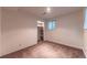 Empty bedroom featuring plush carpeting and a closet for storage at 1583 Skeel St, Brighton, CO 80601