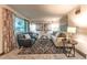 Bright and inviting living room with plush seating, stylish decor, and a large window offering ample natural light at 1583 Skeel St, Brighton, CO 80601