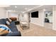Relaxing basement area featuring carpet flooring and a comfortable seating arrangement at 5525 E Bails Dr, Denver, CO 80222