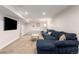 Comfortable basement area with plush seating, perfect for relaxation and entertainment at 5525 E Bails Dr, Denver, CO 80222