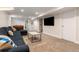 Bright basement featuring carpet flooring, neutral colors and an open living space at 5525 E Bails Dr, Denver, CO 80222