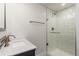 Modern bathroom features a glass enclosed shower with subway tile and updated vanity at 5525 E Bails Dr, Denver, CO 80222