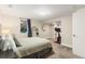Comfortable bedroom with a plush bed, full-length mirror, and exercise bike area at 5525 E Bails Dr, Denver, CO 80222