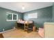Bedroom featuring bed, natural light, and colorful walls at 5525 E Bails Dr, Denver, CO 80222