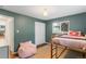 Bedroom featuring bed, window, and plenty of closet space at 5525 E Bails Dr, Denver, CO 80222