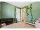 Bedroom featuring a window with plants and a black dresser at 5525 E Bails Dr, Denver, CO 80222