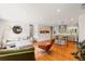 Inviting living room with hardwood floors, contemporary furnishings, and an open layout to the kitchen at 5525 E Bails Dr, Denver, CO 80222