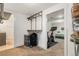 Organized walk-in closet leads to bedroom with home gym equipment at 5525 E Bails Dr, Denver, CO 80222