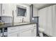 Updated bathroom with white cabinets and granite countertop at 550 E 12Th Ave # 509, Denver, CO 80203