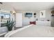 Large bedroom with a dresser and city views from a large window at 550 E 12Th Ave # 509, Denver, CO 80203