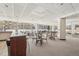 Community room with tables, chairs, and a bar at 550 E 12Th Ave # 509, Denver, CO 80203