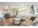 Open concept living room with L-shaped sofa and coffee table at 550 E 12Th Ave # 509, Denver, CO 80203