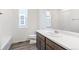 Clean bathroom with single vanity, shower/tub combo and window at 13412 E 110Th Way, Commerce City, CO 80022