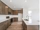 Open concept kitchen with gray cabinets and white countertops at 13412 E 110Th Way, Commerce City, CO 80022