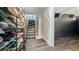 Clean basement with stairs, storage, and laminate flooring at 4301 Fillmore St, Denver, CO 80216