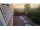 Backyard featuring a stone pathway along the side of a fence and house siding at 1653 Valley Oak Ct, Castle Rock, CO 80104