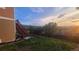 Expansive backyard with stairs to a deck overlooking the lawn at 1653 Valley Oak Ct, Castle Rock, CO 80104