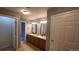 Bathroom boasts double sinks and vanity with lighting, next to entry door at 1653 Valley Oak Ct, Castle Rock, CO 80104