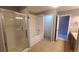 Bright bathroom featuring a shower, bathtub, and double doors to the toilet and vanity areas at 1653 Valley Oak Ct, Castle Rock, CO 80104