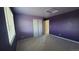Neutral carpeted bedroom featuring a window, and double sliding door closet at 1653 Valley Oak Ct, Castle Rock, CO 80104