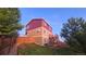 Three-story home with a combination of siding and a backyard and deck at 1653 Valley Oak Ct, Castle Rock, CO 80104